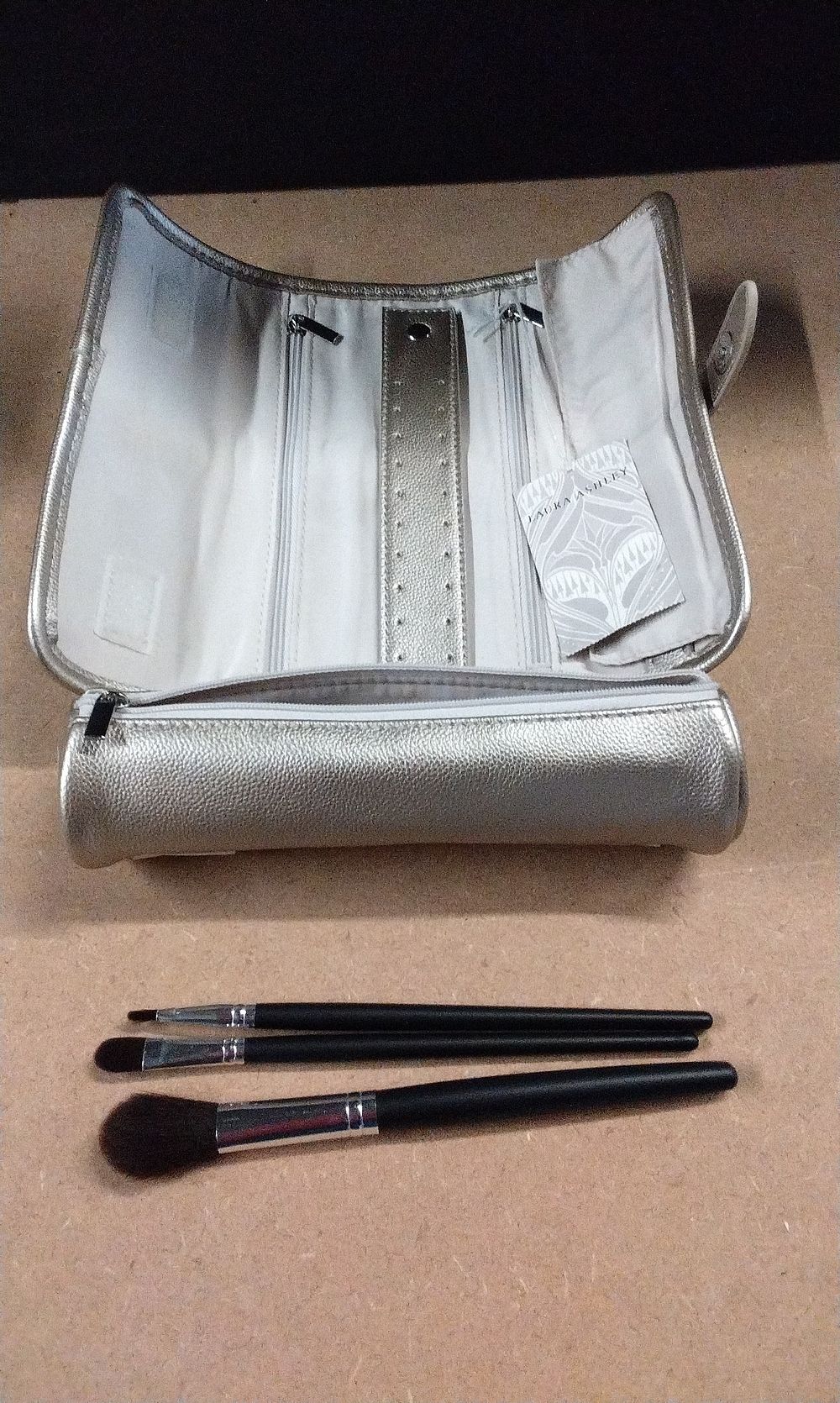 Lot 365: Laura Ashley Brand New Jewellery Roll with Three Makeup Brushes
