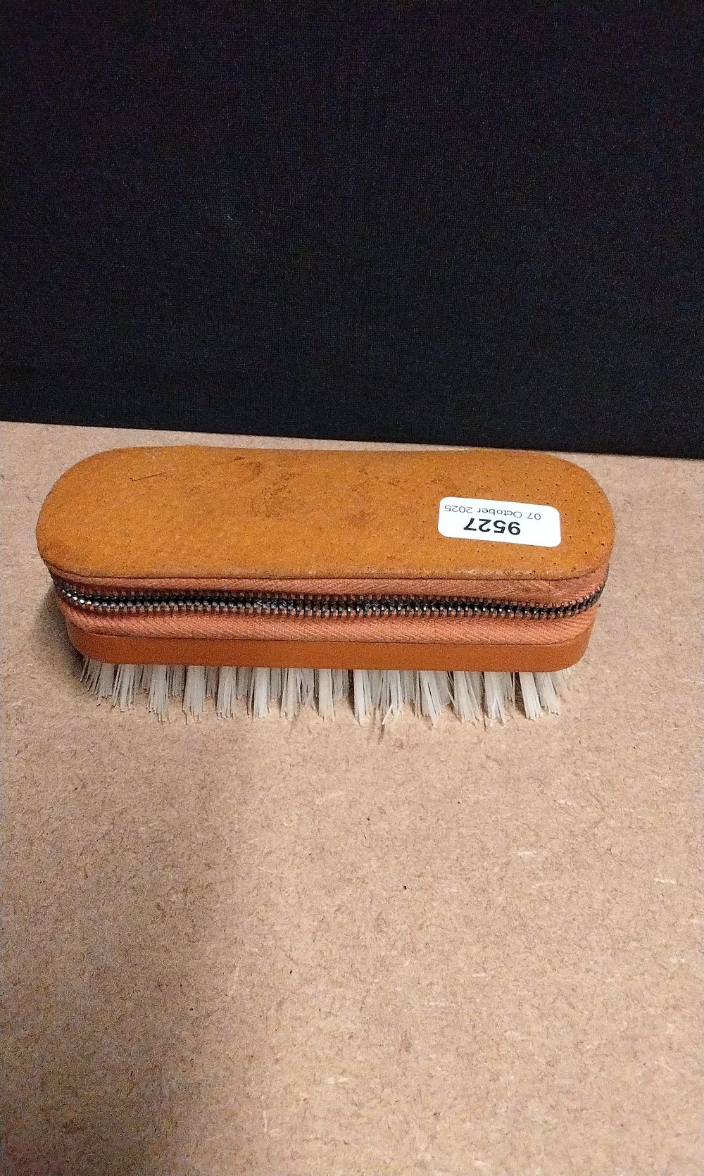 Lot 394: A Vintage English Leather Travel Grooming Kit, designed as a Brush