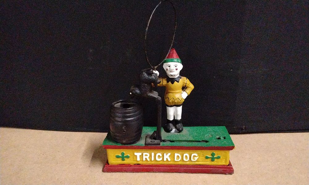 Lot 448: A Cast Iron Mechanical Trick Dog Clown Bank