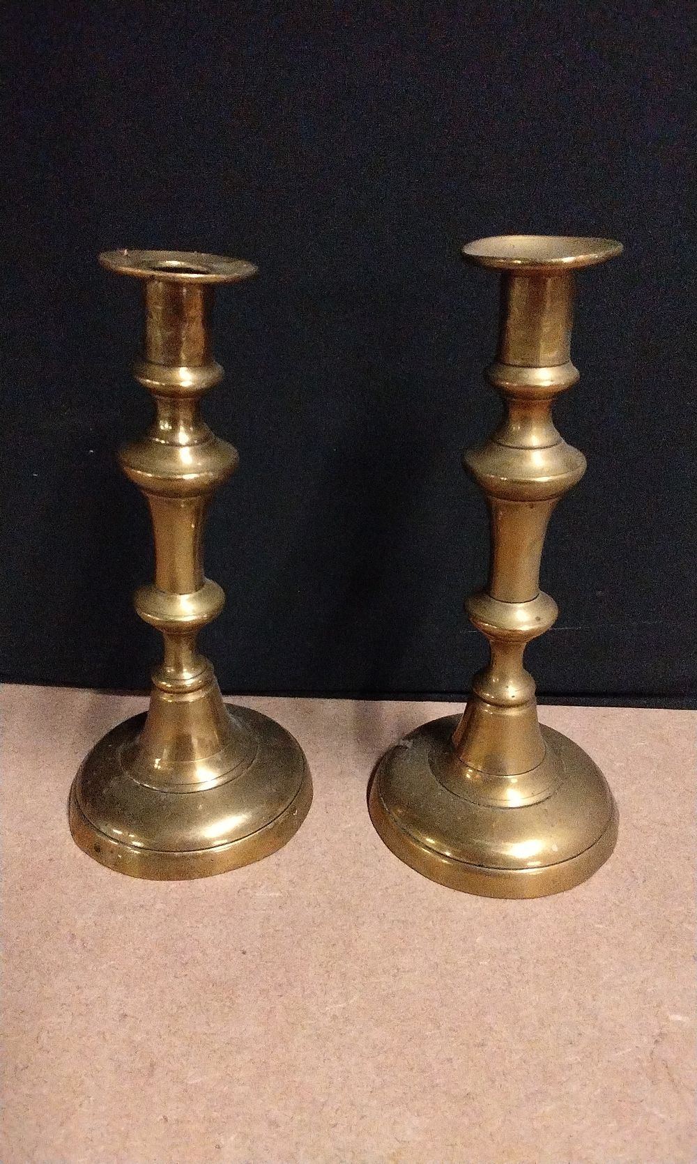 Lot 450: A Pair of Brass Candlesticks