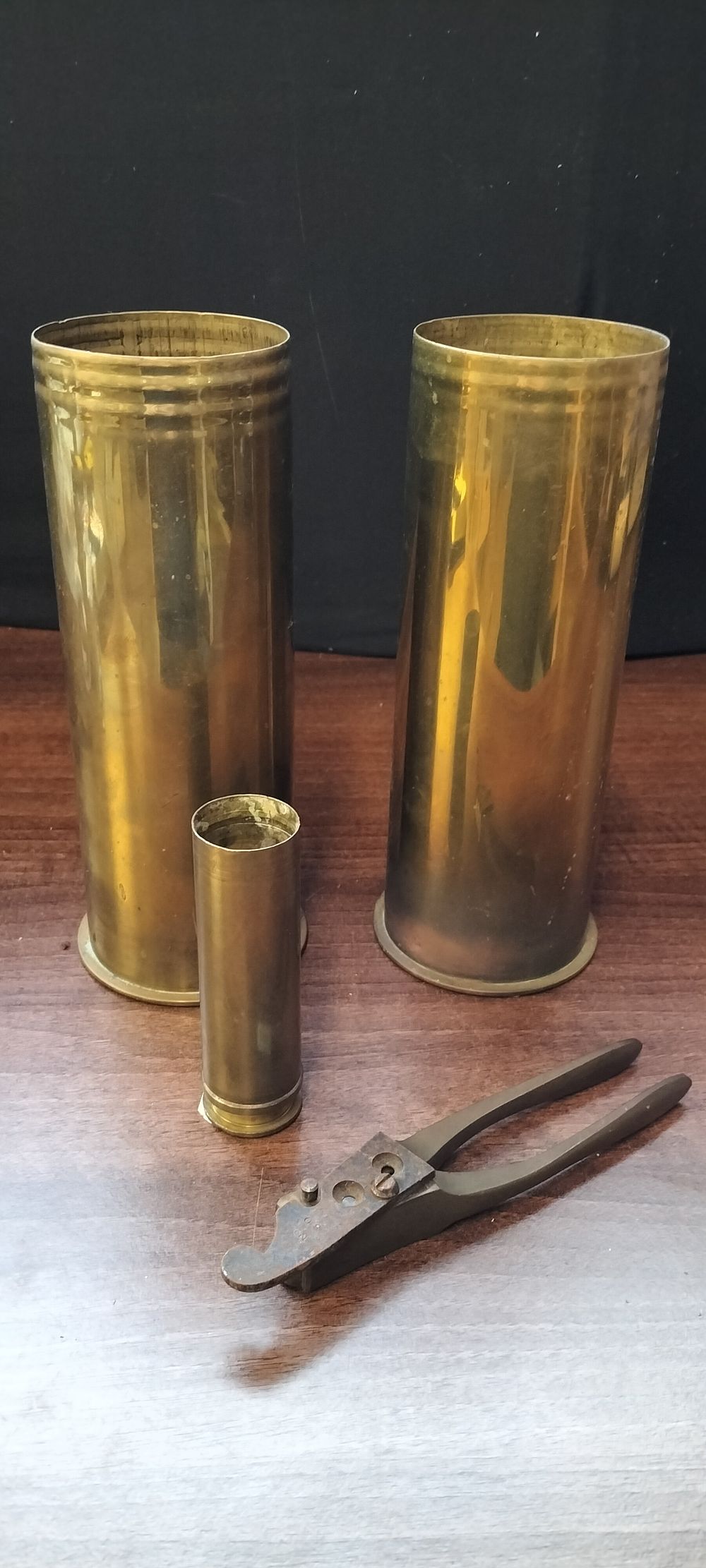 Lot 461: Three WW1 Brass Artillery Shell Casings and Hand Tool