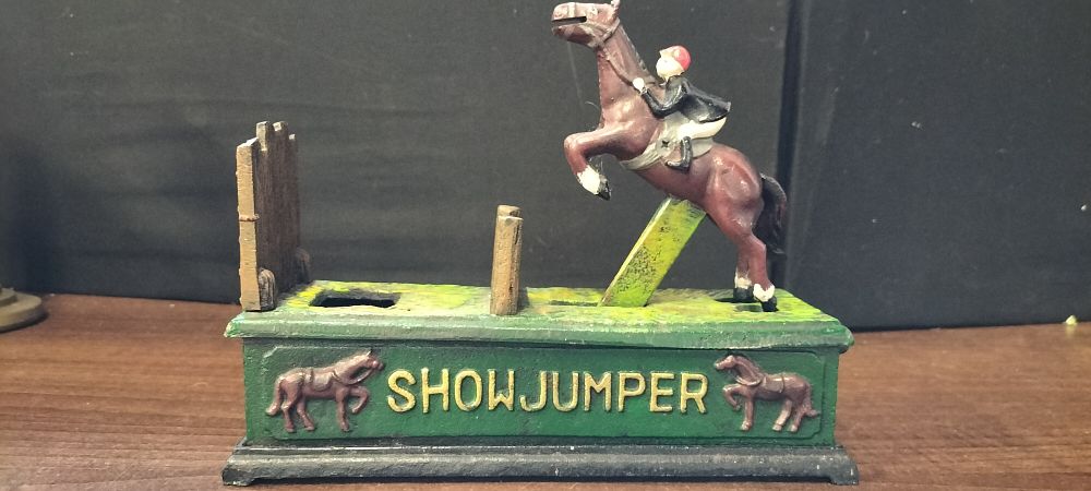 Lot 468: Cast Iron Show Jumper Mechanical Piggy Bank