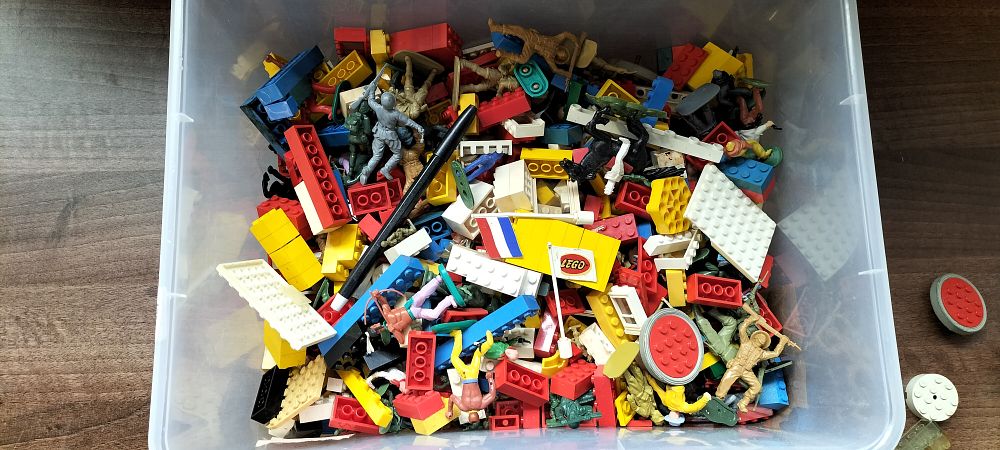Lot 491: Bulk LEGO Bricks, Figures, and Vintage Instruction Sheets
