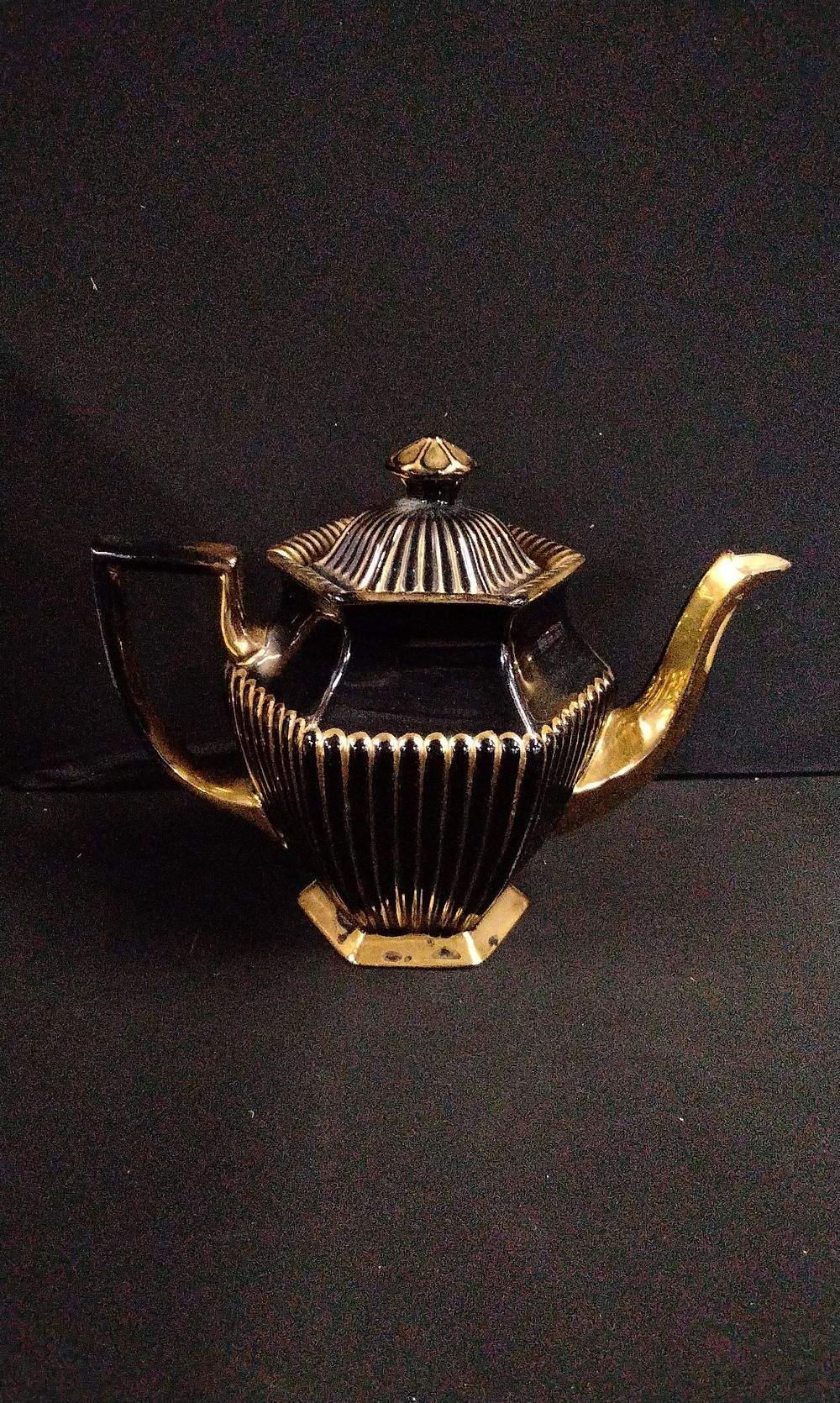 Lot 650: A Black and Gold Hexagonal Teapot, Made in England