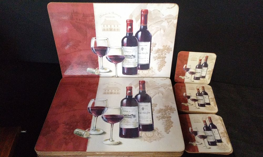 Lot 690: A Set of Wine Themed Placemats and Coasters