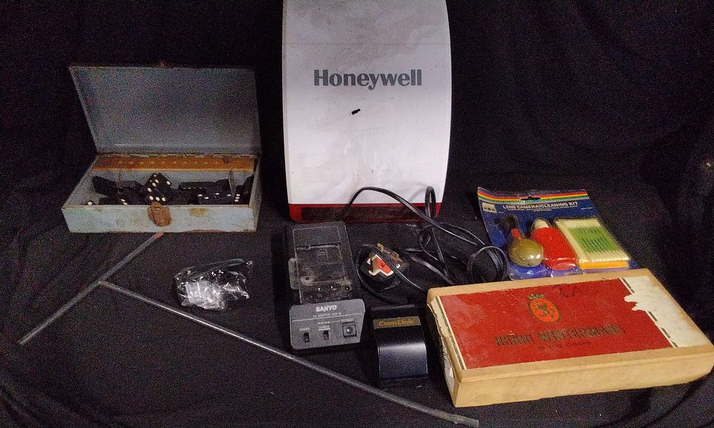 Lot 706: A Collection of Honeywell Siren, Dominoes, and Electronics