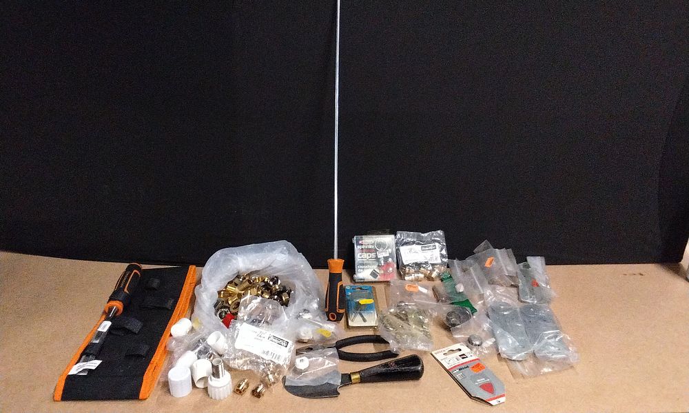 Lot 618: A Collection of Plumbing Fittings, Components, and Tools