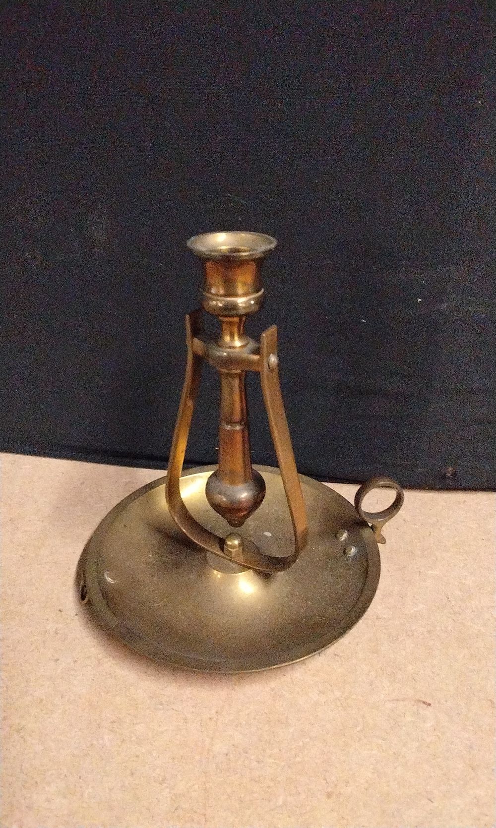 Lot 624: A Single Brass Nautical Gimbal Chamberstick
