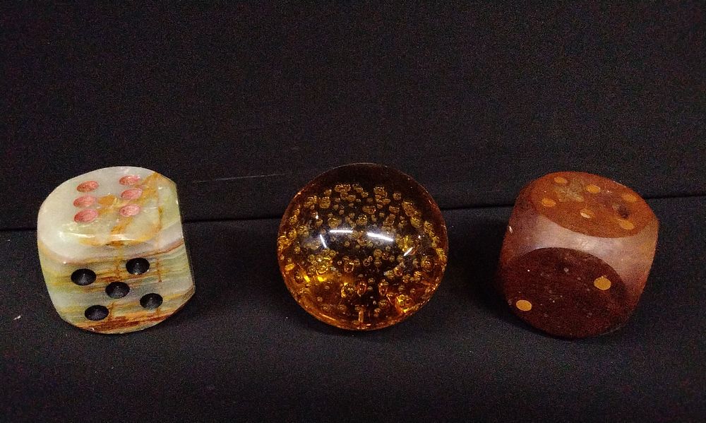 Lot 653: A Group of Oversized Dice, Amber coloured glass Sphere Paperweight