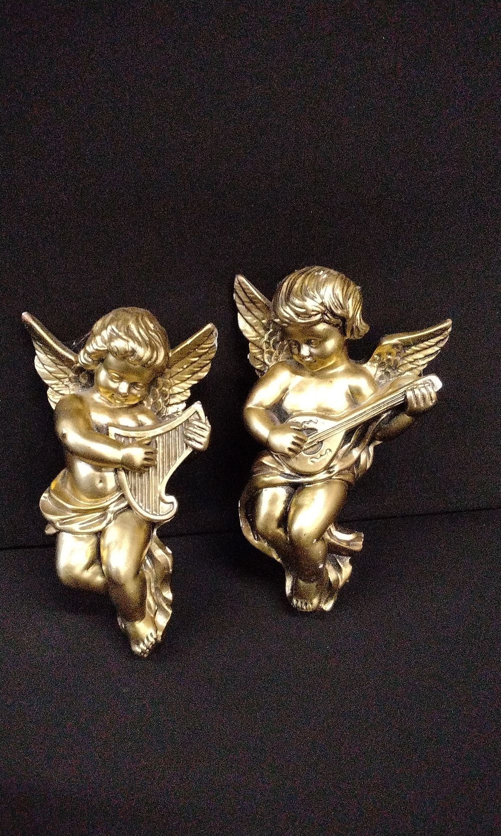 Lot 654: A Pair of Gold Cherub Figures, Harp and Lute