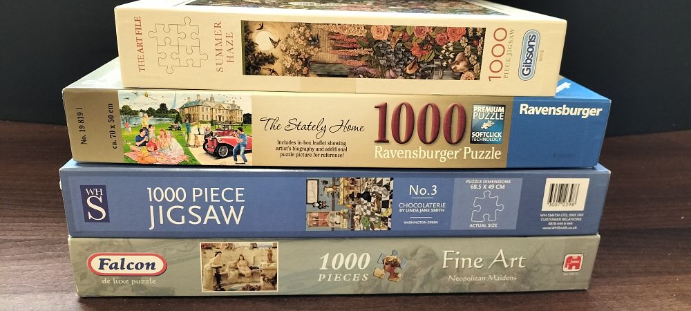 Lot 685: A Collection of Four 1000-Piece Jigsaw Puzzles