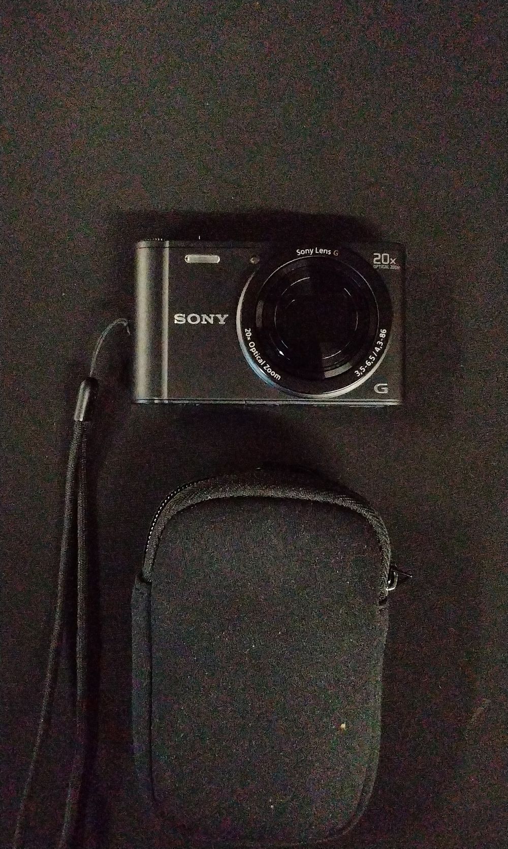 Lot 718: Sony Cybershot DSC-WX300 Black Digital Camera with Case. No Power Supply
