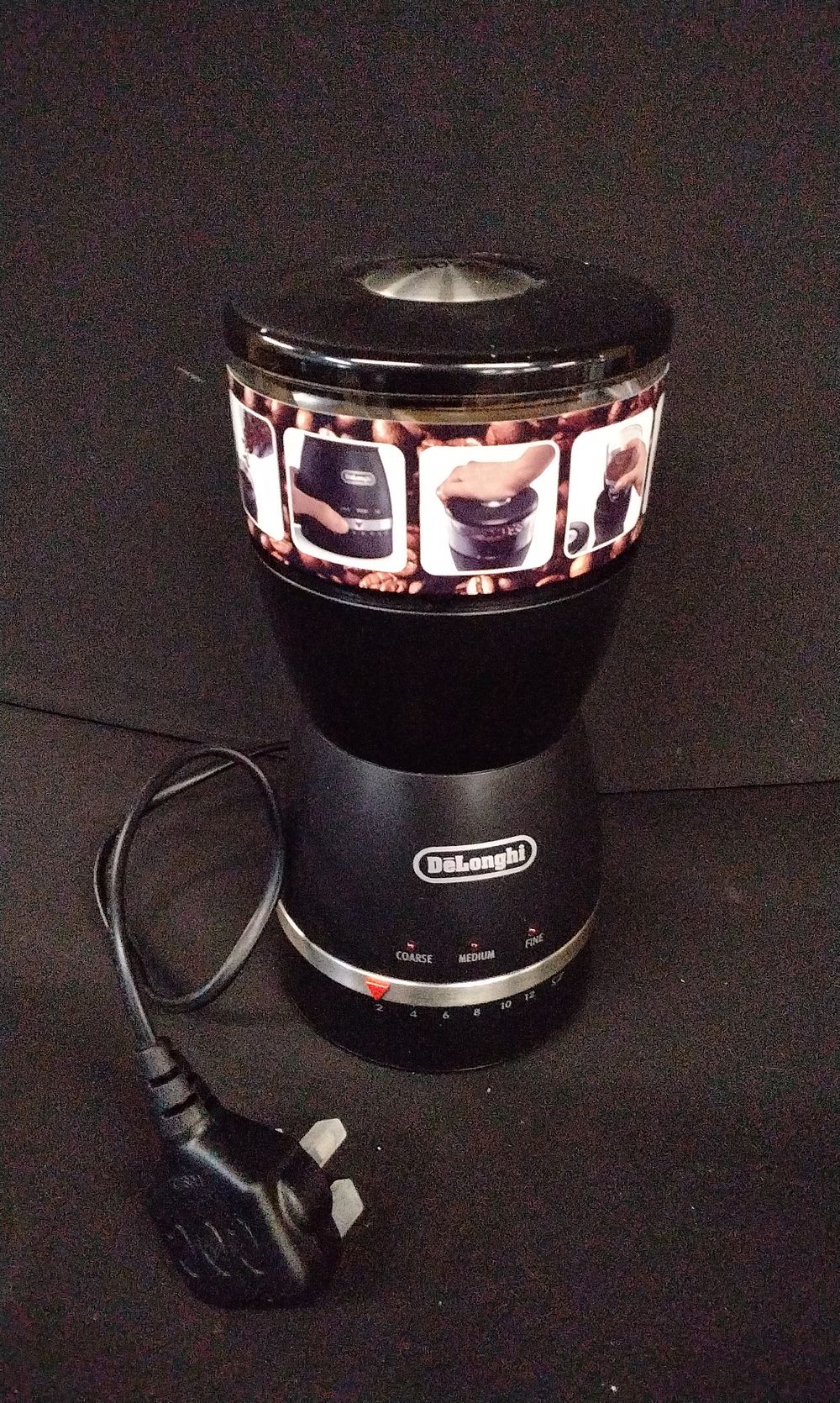 Lot 728: DeLonghi Black and Silver Electric Coffee Grinder. Tested for Power