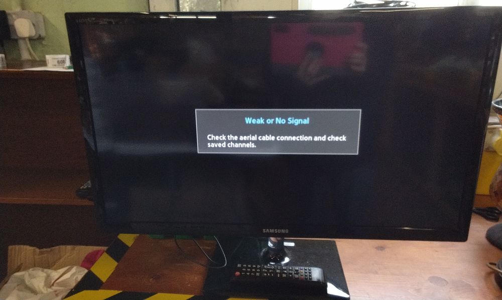 Lot 740: A Samsung Flat-Screen Television with Remote and Adapter. Tested for Power. COLLECTION ONLY