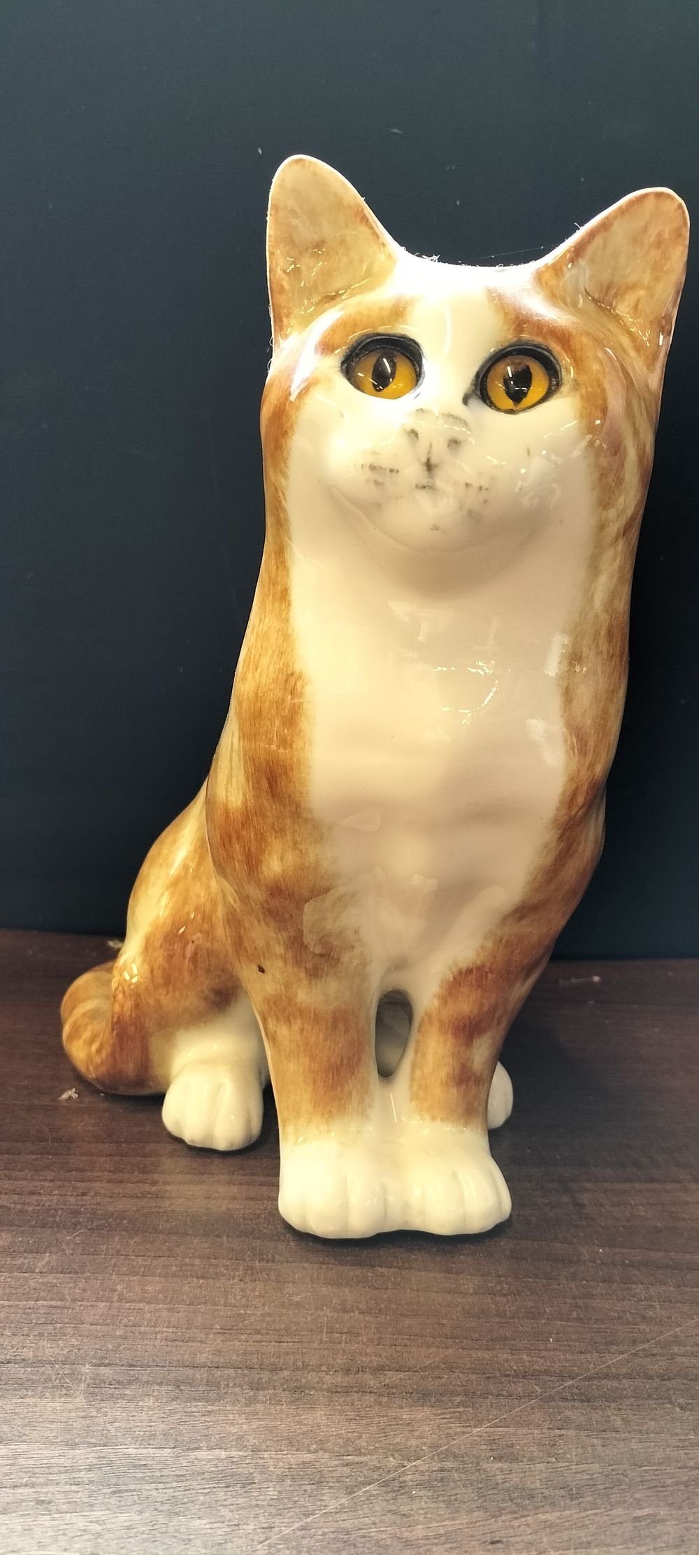 Lot 769: A Mike Hinton Orange and White Ceramic Cat Figurine