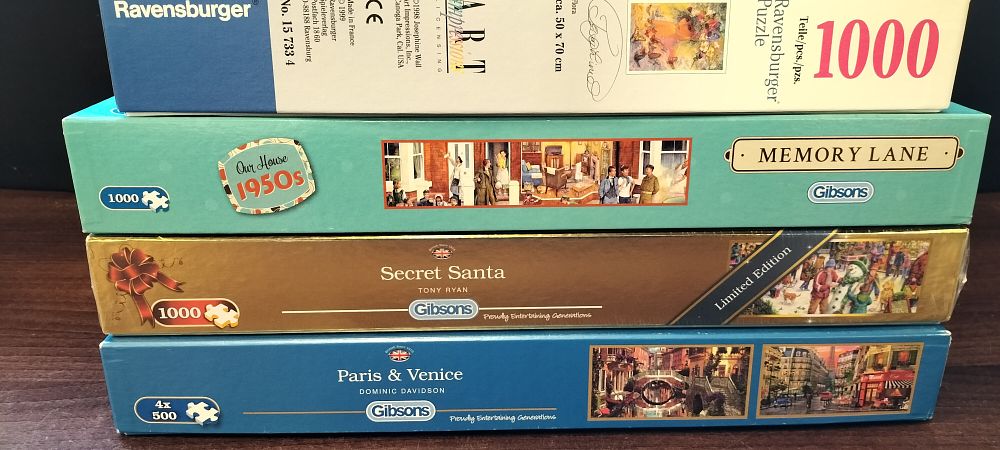 Lot 793: Four Gibsons and Ravensburger Jigsaw Puzzles