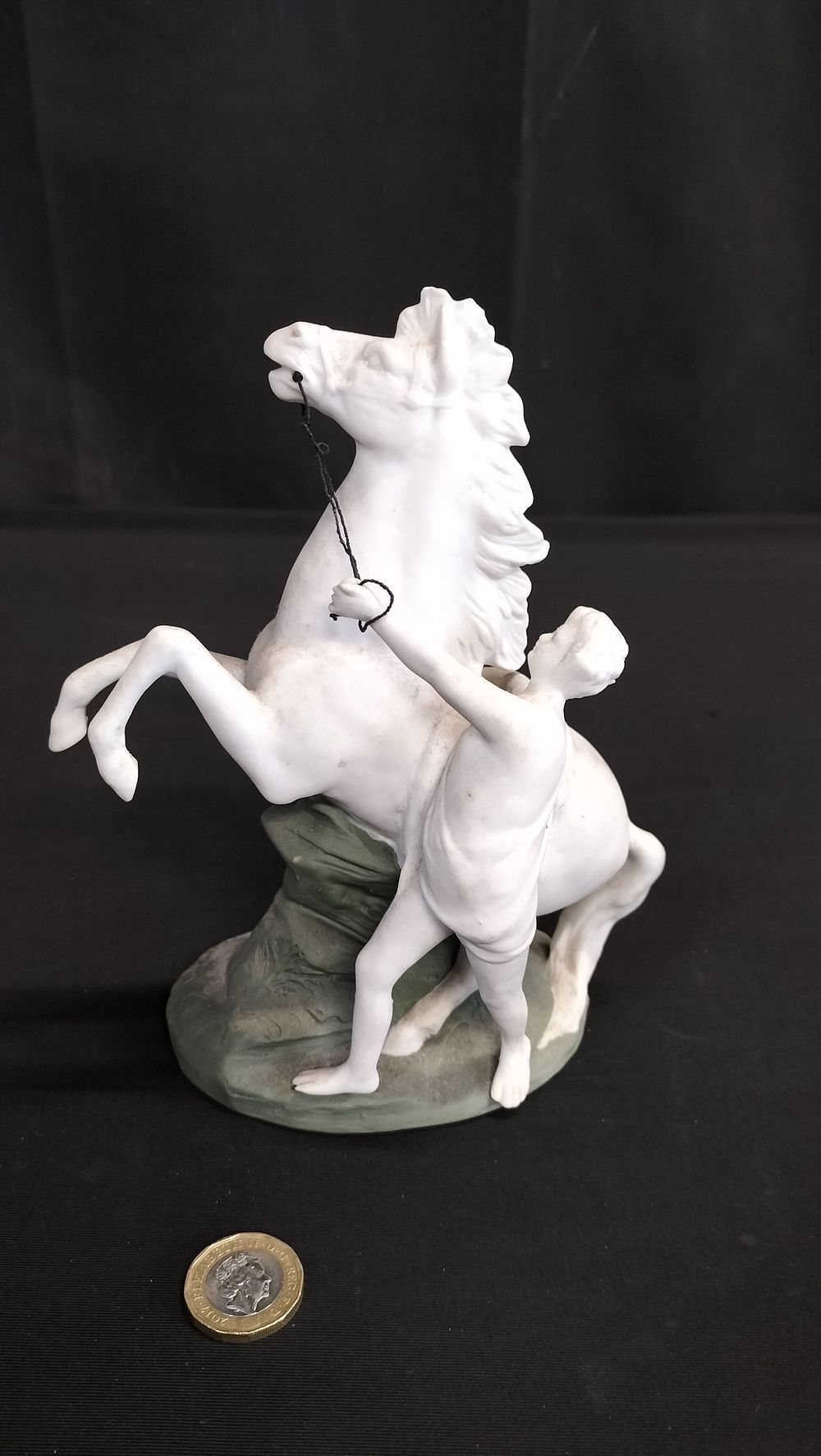 Lot 284: Figure of a man taming a horse. Measures approx 17.5 x 15.5 cm