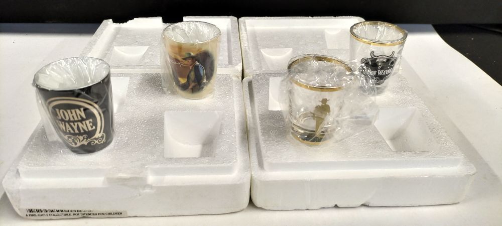 Lot 859: Two Pairs of Bradford Exchange John Wayne Shot Glasses in Original Packaging with Certificate of Authenticity
