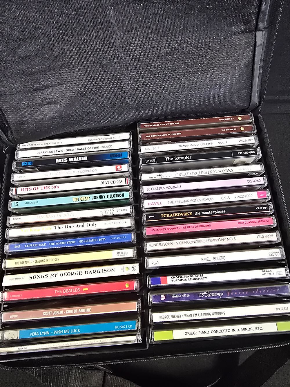 Lot 869: A collection of CDs includes the Beatles