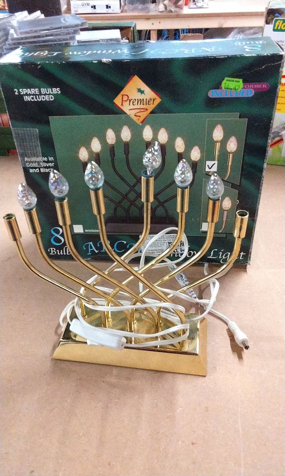 Lot 566: Premier Gold-Colored 8-Bulb Arc Window Candle Bridge Light. Untested No power Supply