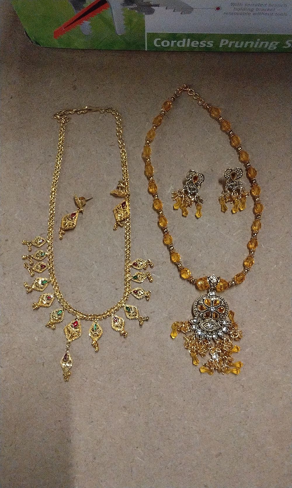 Lot 579: Two  Gold-Toned Necklace and Earring Sets