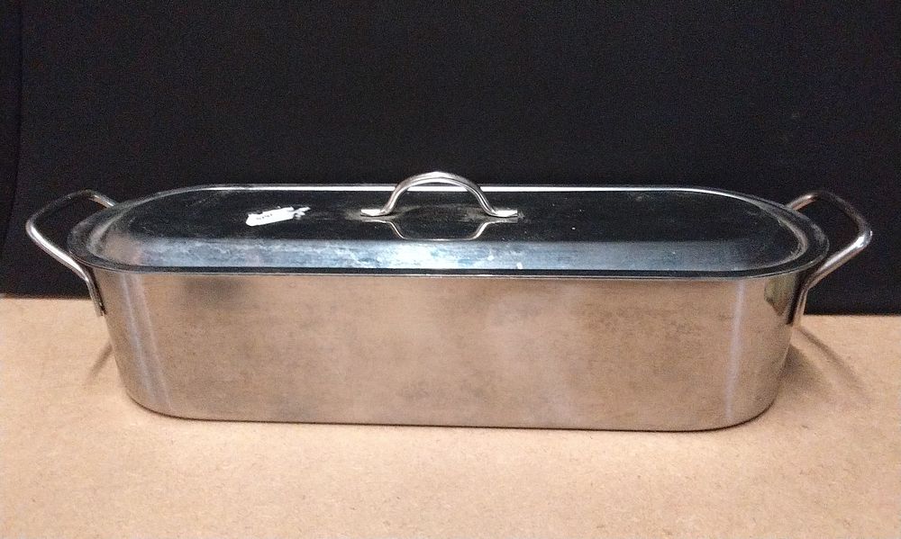 Lot 619: A Modern Three-Piece Stainless Steel Fish Poacher and Steamer