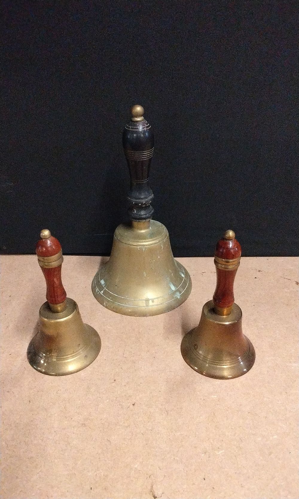 Lot 648: Three Brass Hand Bells with Wood Handles. Two Have No Strikers