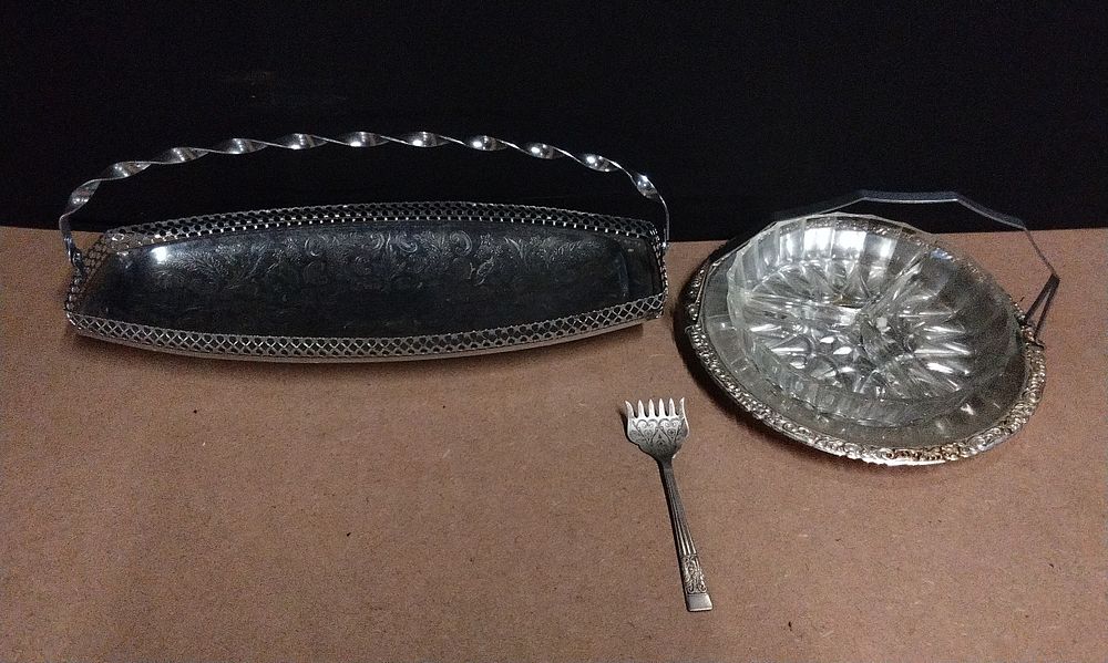 Lot 649: Three Silver Tone Serving Pieces, comprising a Sandwich Tray, a Display Dish with Glass Insert, and a Serving Fork