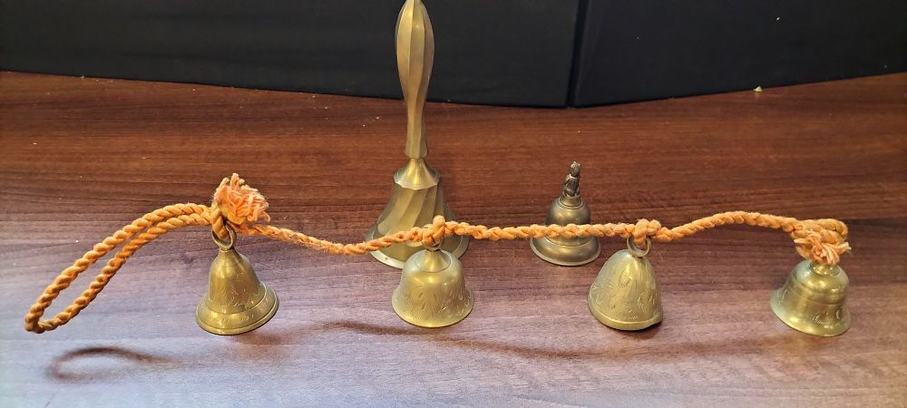 Lot 668: Three Brass Bells, including Nepal Monkey and Hanging Bells