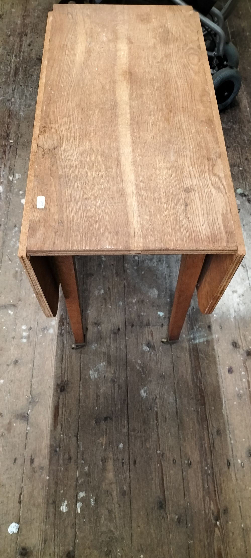 Lot 697: Light Brown Wooden Drop-Leaf Table with Casters