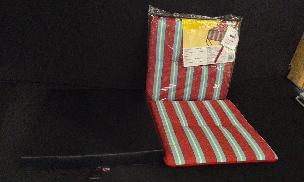 Lot 710: A Pair of Jordan Manufacturing Striped Patio Seat Pads and a Black wipe Clean Seat Pad