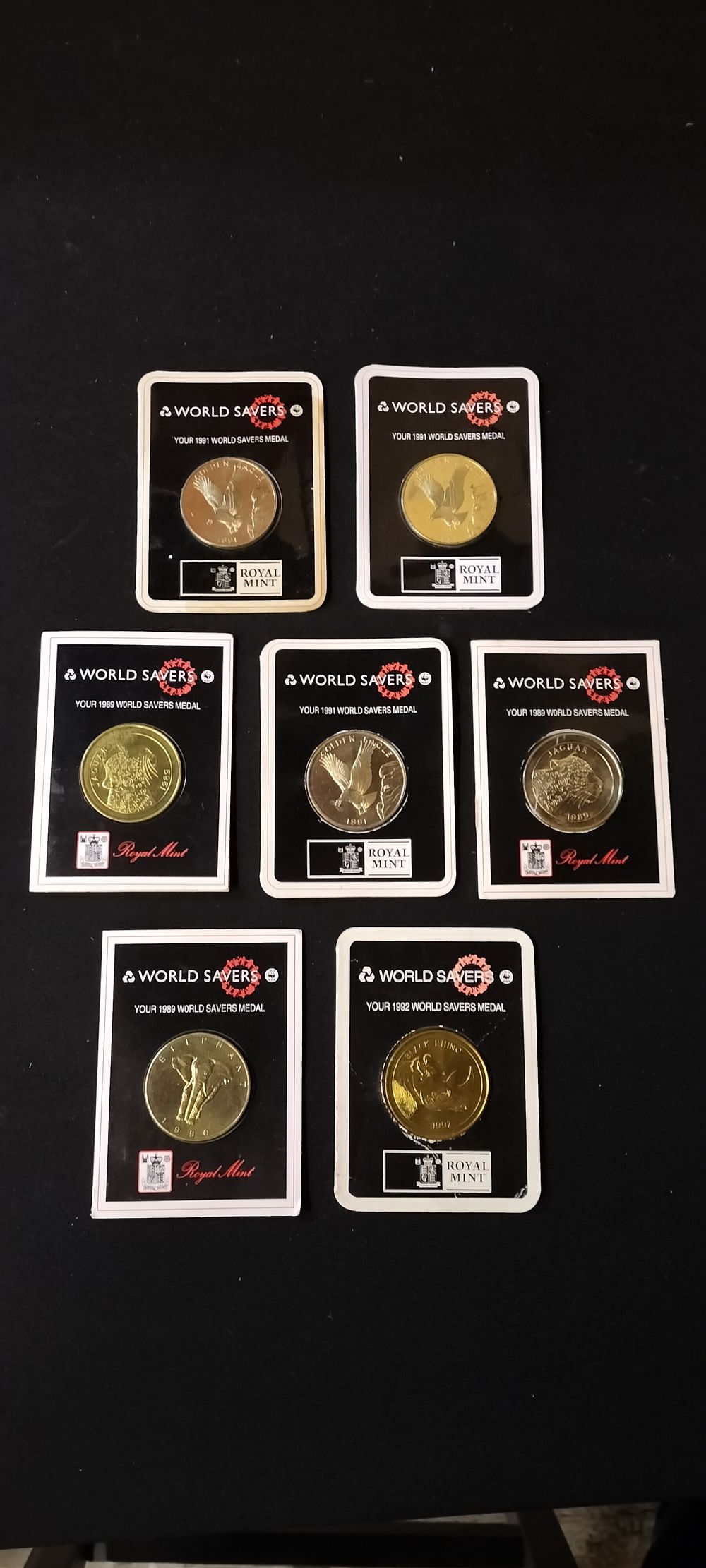 Lot 150: 7 Sealed World Savers Coins, 1 Rhino, 1 Elephant, 2 Leopards & 3 Eagles