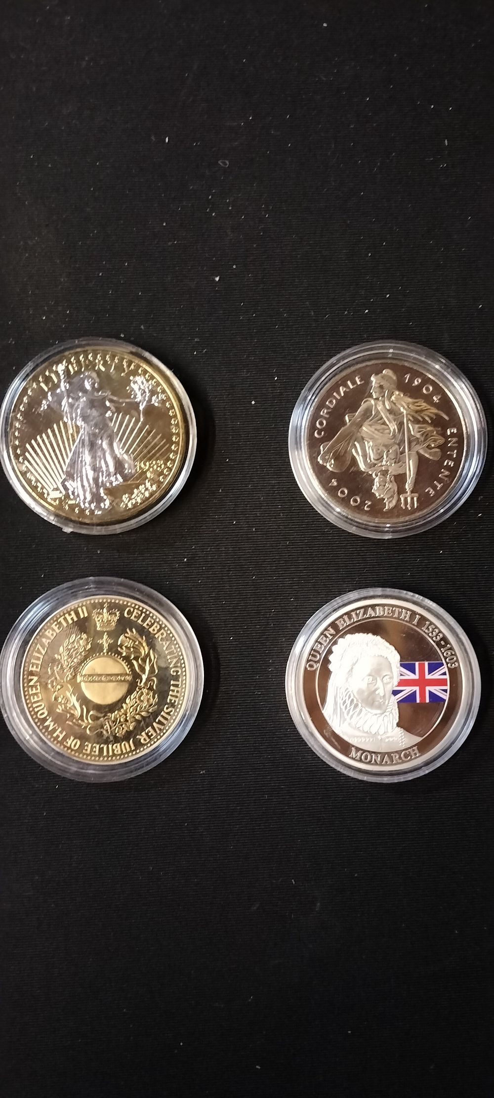 Lot 165: Four Silver & Gold Plated Commemorative Coins in Plastic Cases
