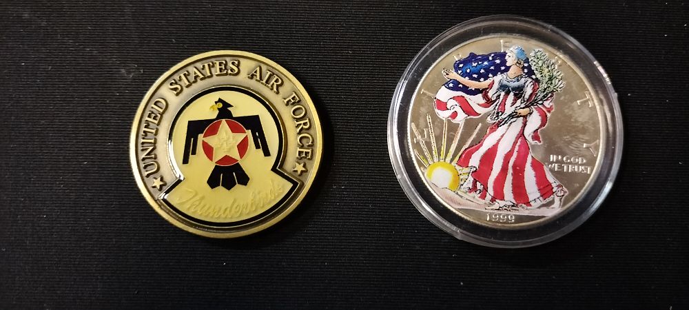 Lot 169: 1999 American Eagle Silver Dollar plus a U.S. Air force Demo Sqn Token
