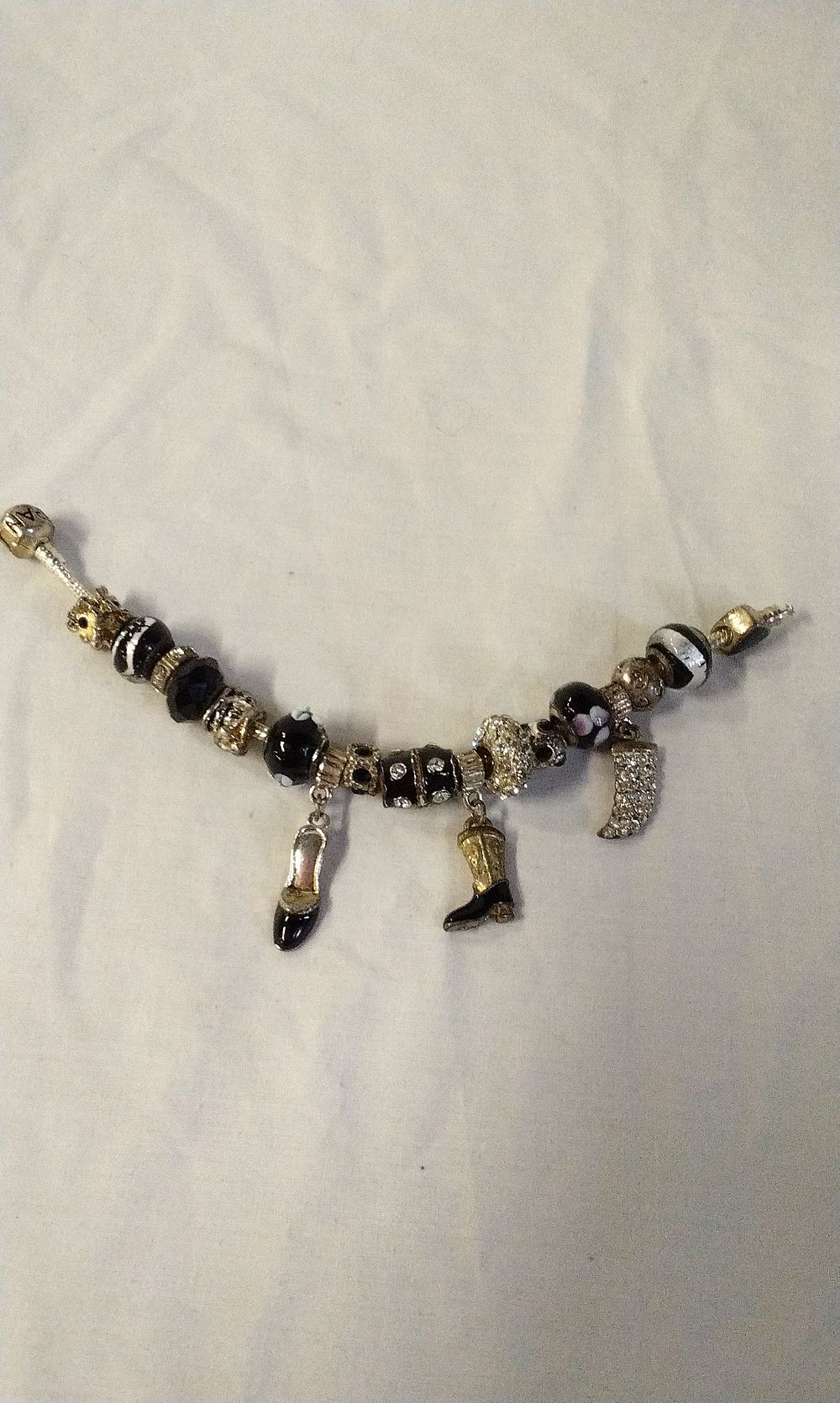 Lot 204: Pandora Style Bracelet with 17 Charms Some Marked 925