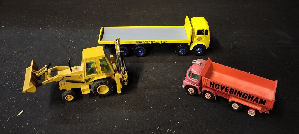 Lot 176: Three Die-Cast Vehicles Including Two Trucks and a Back Hoe