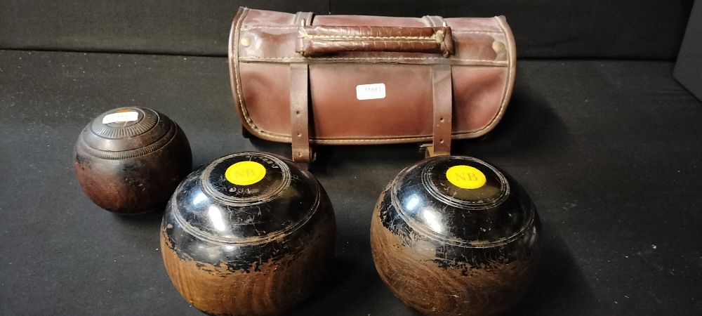 Lot 181: A set of Lignum Vitae Lawn Bowling Balls with Leather Carry Case and a Jack Ball.