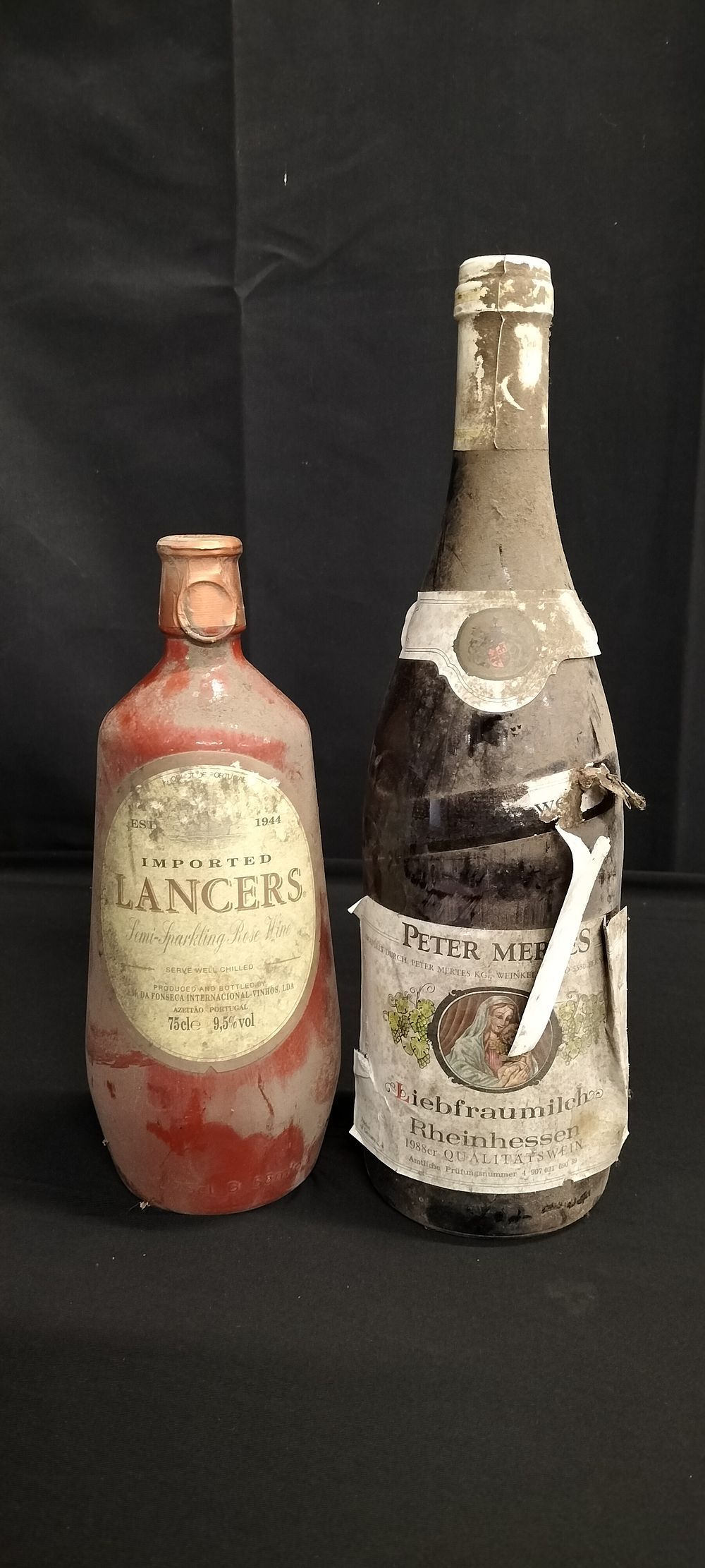 Lot 184: Two unopened bottles of wine. A vintage pot...