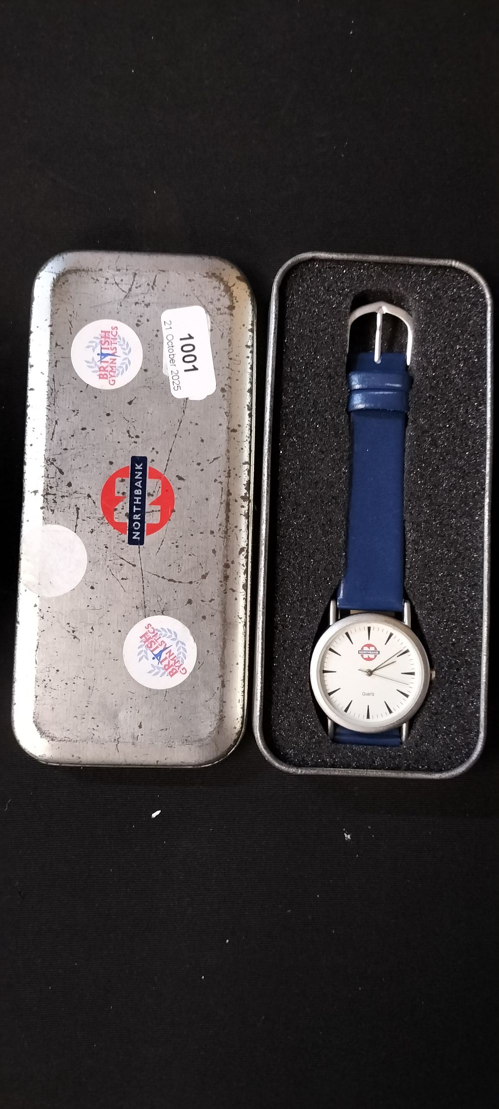 Lot 191: North bank Quartz Watch with Leather Strap in a Metal Presentation Tin