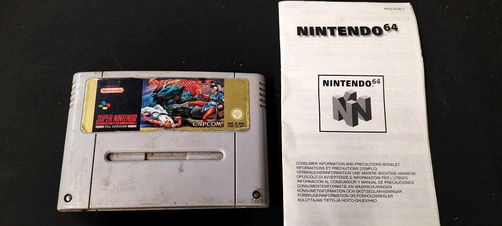 Lot 192: Super Nintendo Street Fighter 2 Cartridge Only and an Information Booklet for Nintendo 64