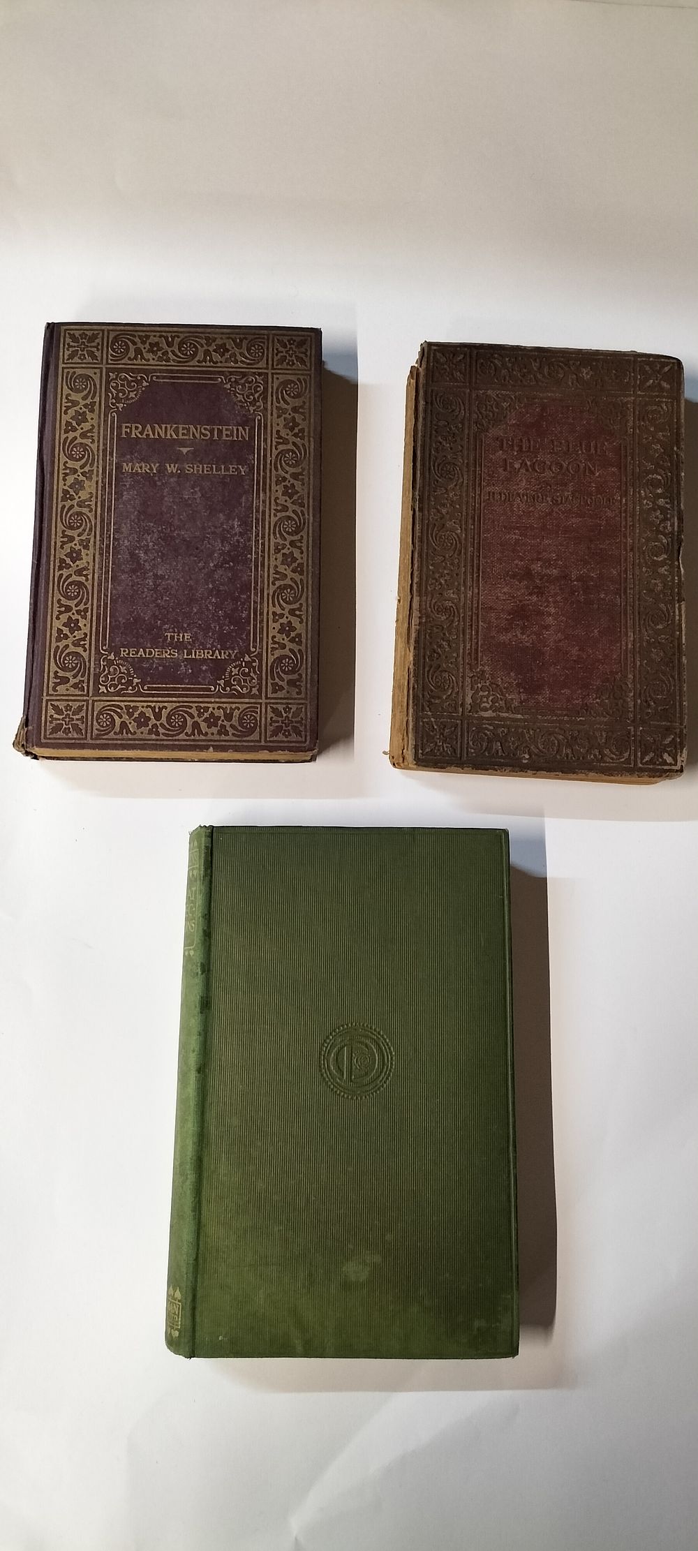 Lot 196: Three Antique Books, two from Readers Library and one from Popular Edition