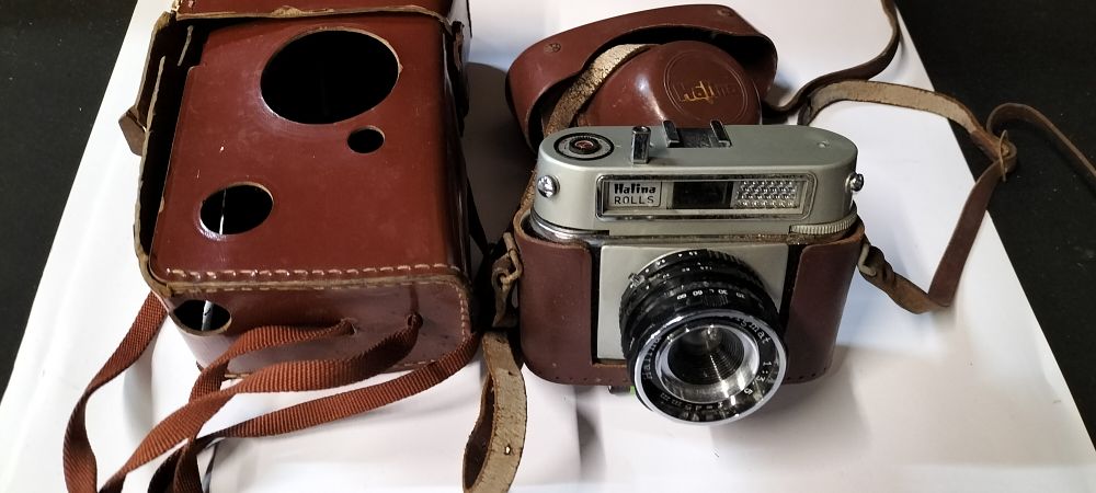 Lot 199: A Halina Rolls 35mm Film Camera Circa 1960's with Case and a Kodak Leather Field Case