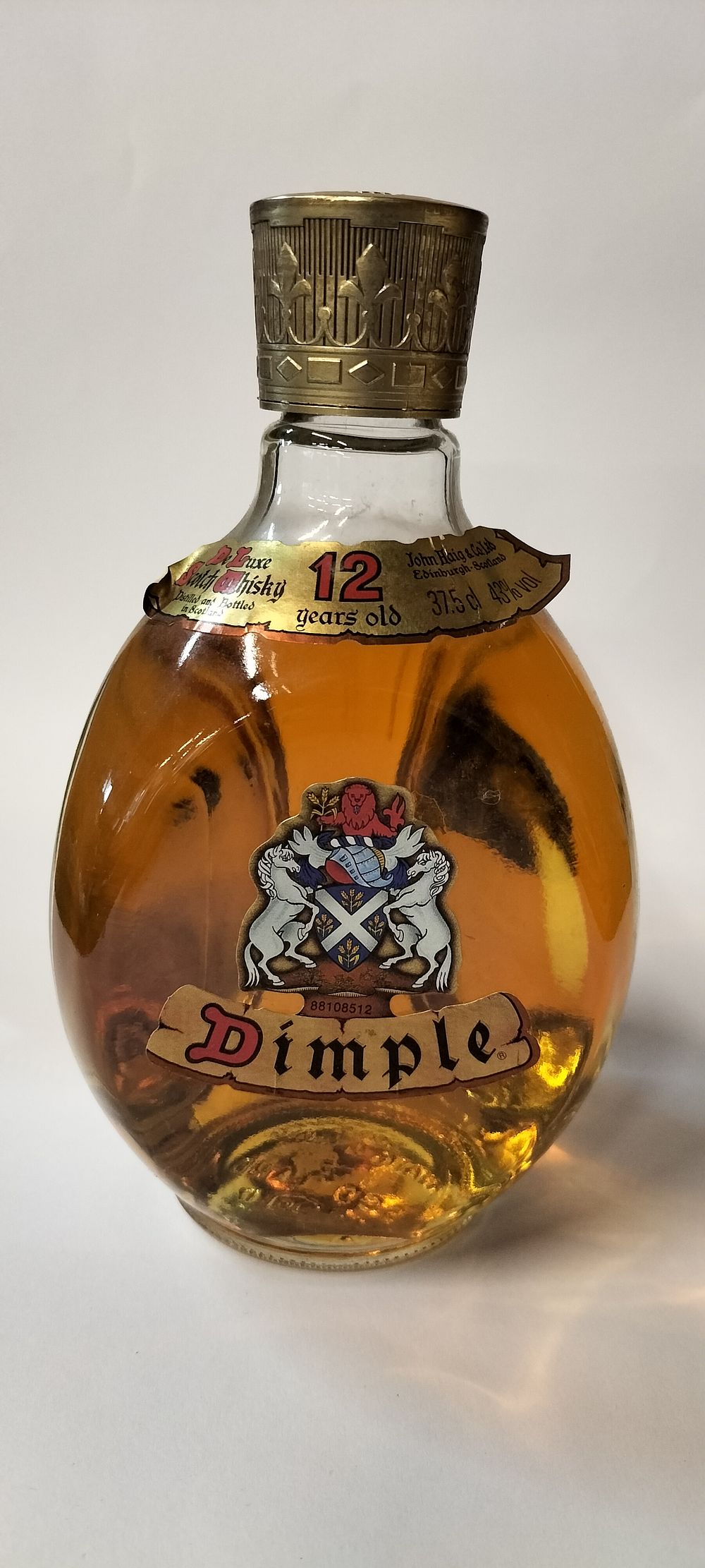 Lot 299: An Unopened bottle of 375 cl Haig Dimple 12 years old whiskey