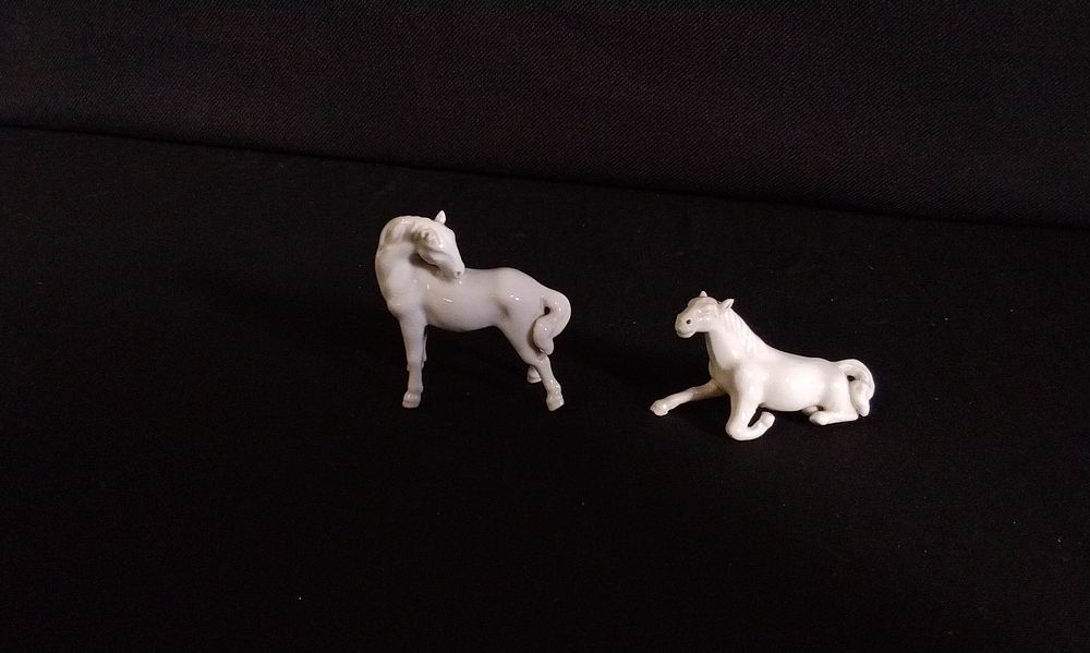 Lot 259: Two White Miniature Ceramic Horses