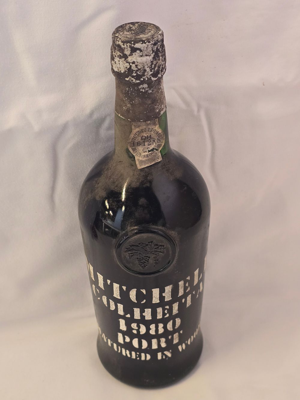 Lot 308: A bottle of unopened Mitchell Colheita 1980 vintage port