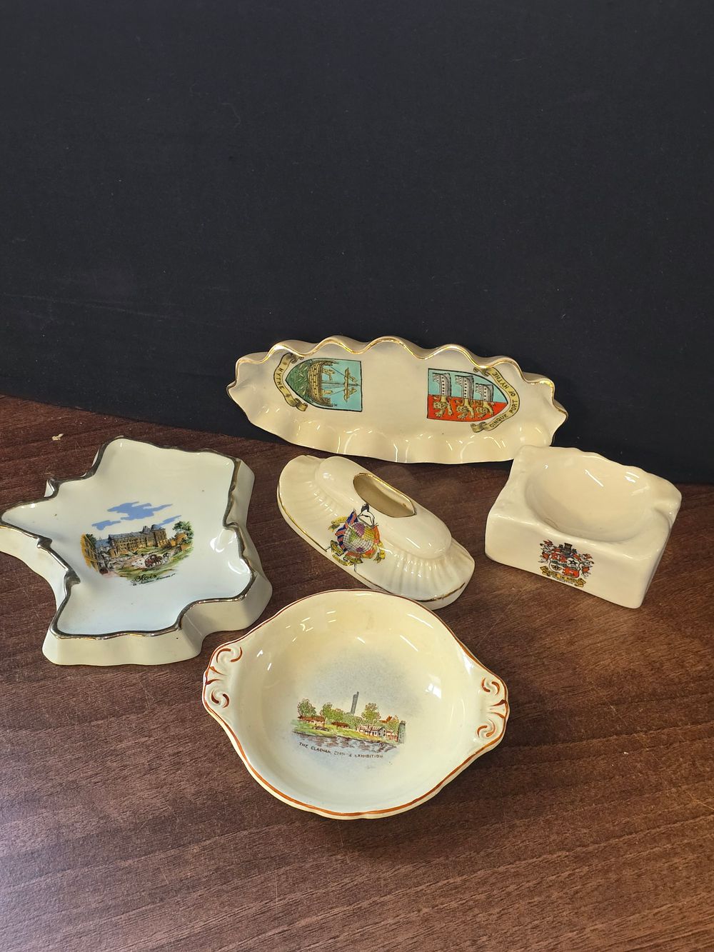 Lot 315: A collection of mainly W.H.Goss pottery.  Depicting various scenes and locations