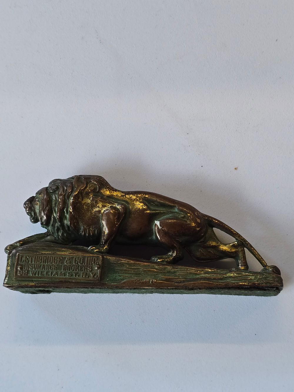 Lot 318: Brass with bronzed finish Lion paperweight.  From LethBridge insurance brokers New Yok.  Date 1919