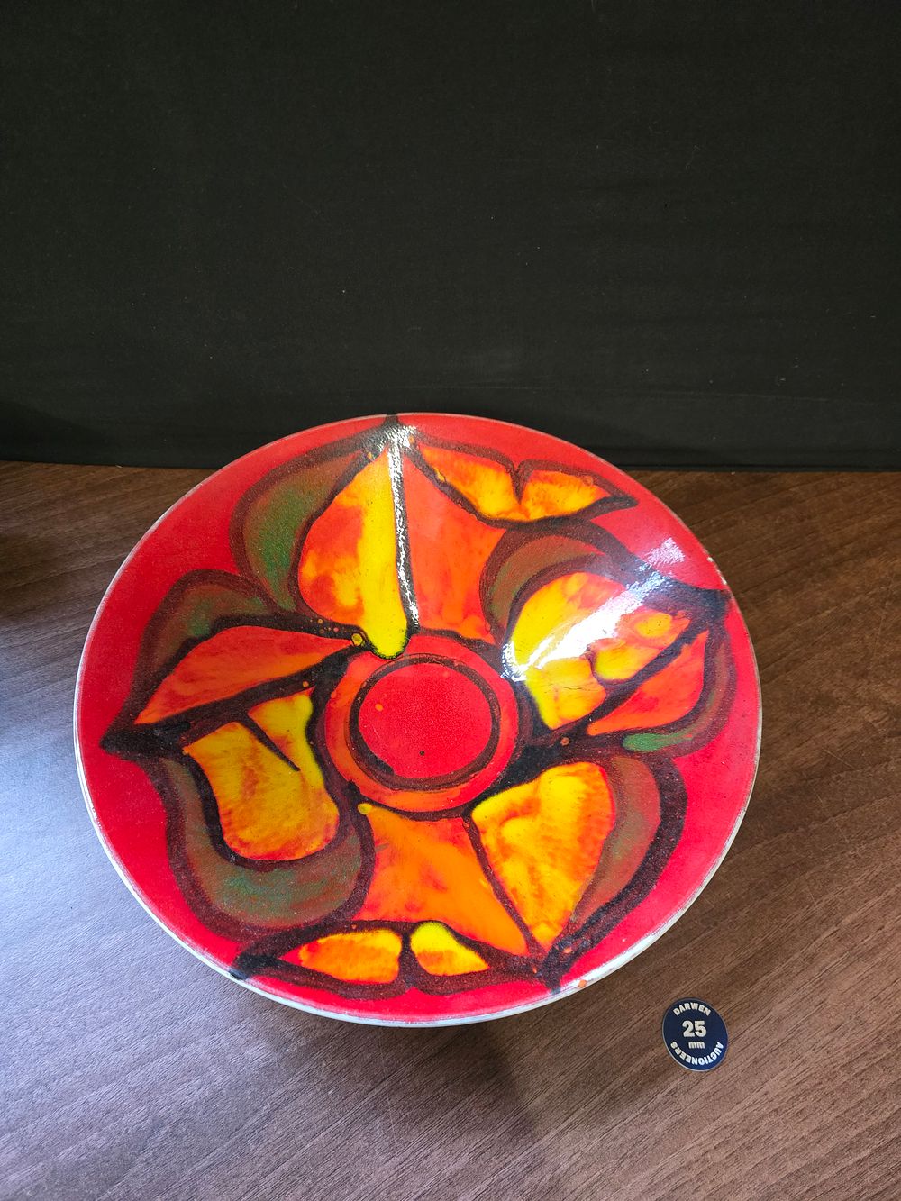 Lot 322: a vintage Poole Pottery Delphis plate with a hand-painted abstract design. 