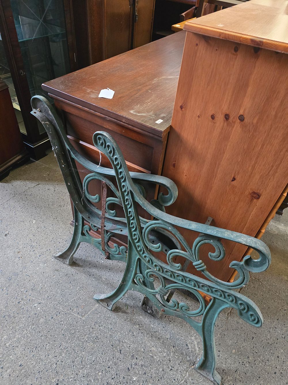 Lot 326: A pair of cast iron bench ends in green