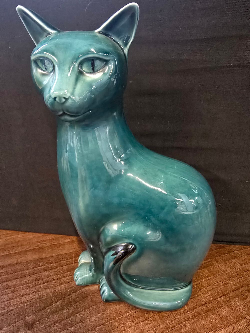 Lot 328: Poole Pottery cat figurine, specifically a large cat from the "Blue Dolphin Glaze" collection.